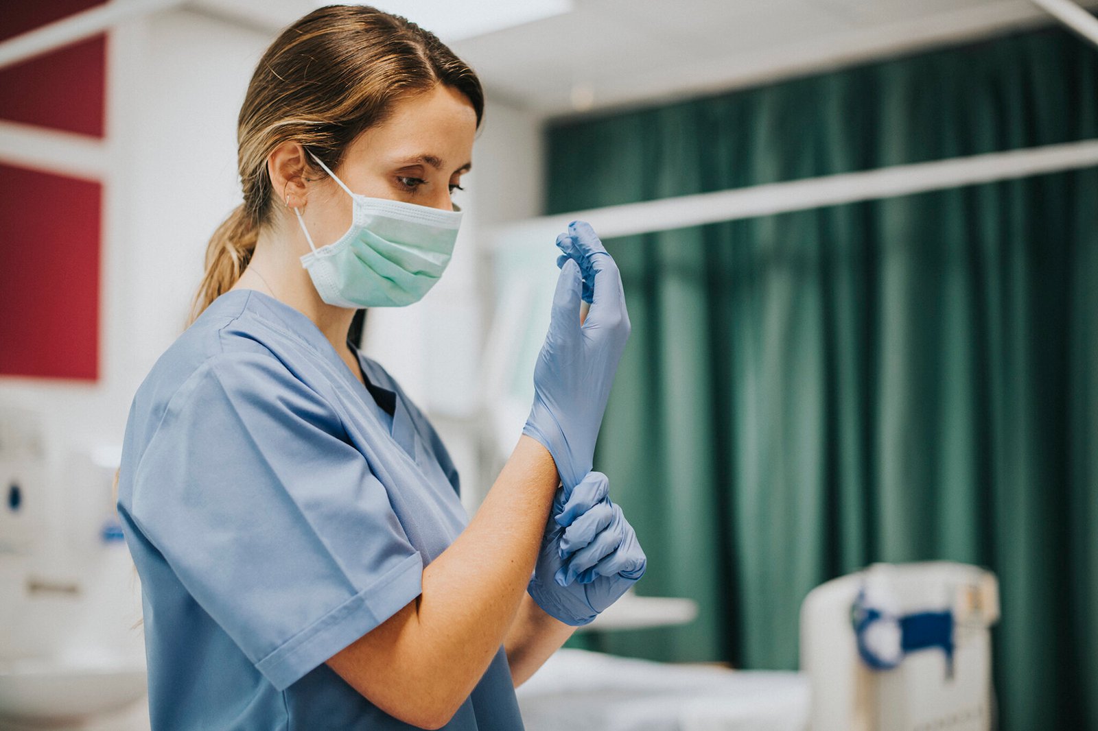 A doctor or community medical professional setting up healthcare instruments in India